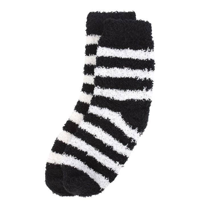 Chaussettes rayées dans un coffret cadeau en forme de cercueil
