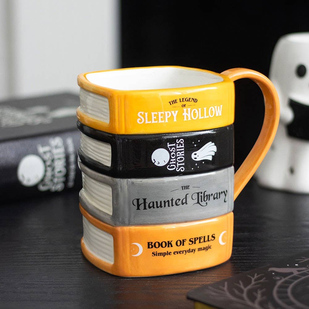 La tasse « Pile de livres de la bibliothèque hantée »